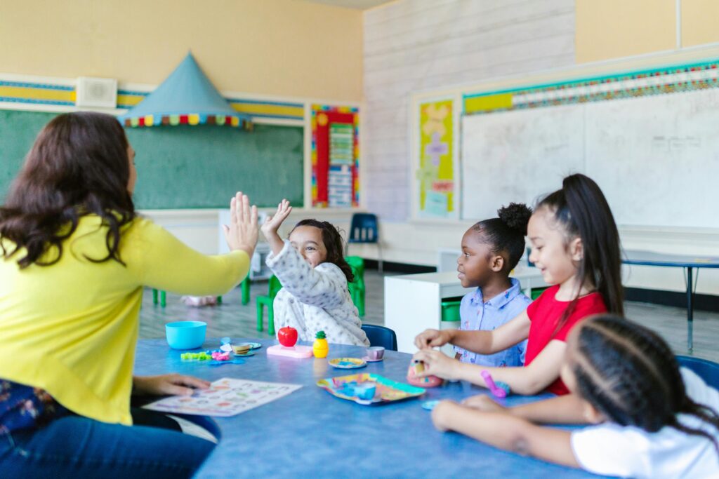 Teacher and Student High Fiving